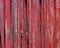 Red painted weathered wood stripes