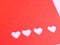 Red paper, punching in a heart shape, placed on pink paper for the background of your text.