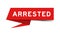 Red paper speech banner with word arrested on white background