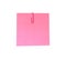 A red paperclip with blank pink notepaper. Pink sheet for your message or adding more text. Memo note with paper clip