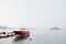 Red parasailing boat on a calm blue sea of Bodrum, Turkey