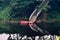 Red parked speed boats around water of a lake