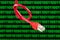 Red patch cable with knot against computer screen with digits
