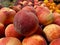 Red peaches on display fresh market retail grocery store