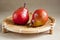 Red pears on wooden tray