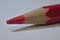 Red pencil sitting on desk