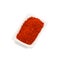 Red pepper pod on pile of chili powder isolated on white