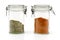 Red pepper powder and oregano in jars