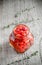 Red peppers drops in glass jar