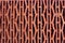 Red perforated brick background