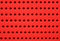 Red perforated plastic background