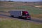 Red Peterbilt Semi-Truck / Loaded Flatbed