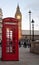 Red phone booth with the Big Ben in the bac