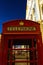 Red phonebooth in London by night