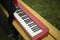 Red piano. Sound synthesizer. White keys. Electronic grand piano
