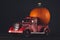 Red pickup truck with pumpkin. Vintage farm toy pickup truck car. Pumpkin good for carving a Jack o Lantern on Halloween