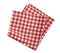 Red picnic checkered folded towel isolated on white.Food decoration element