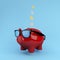 Red Piggy savings Floating on blue background. used for concept design or website.