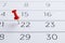 Red pin on the date 22th on the calendar close-up. Important date. Place for text.