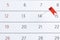 Red pin flag on a calendar. Important date. Place for text.