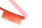 Red and pink comb different size isolated