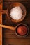 Red and Pink Crystal Rock salt in rustic wooden spoons