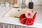 Red and pink gerbera daisies in a kitchen sink. Rustic kitchen interior design