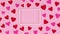 Red and pink valentine hearts move around frame for text. Stop motion