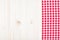 Red plaid cloth on white wood