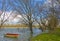 Red plastic boat floats on the river