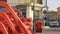 Red plastic chairs stacked outside a cafeteria closed