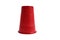 Red plastic cup stands upside down on a white background