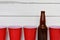 Red Plastic Drinking Cups and One Beer Bottles