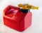 Red plastic gasoline can on white background