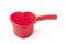 Red plastic ladle similar to a heart