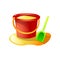 Red plastic sand bucket with green shovel toy