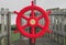 Red playground ship steering wheel