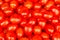 Red plum tomatoes background