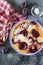 Red plums clafoutis, icing sugar dressing, french cuisine