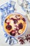 Red plums clafoutis, icing sugar dressing, french cuisine