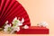 Red podium paper oriental fan flowering branch with buds pink pastel background