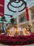 Red Poinsettia Flowers and Gold Reindeer Sculptures Around a Water Fountain in West Mall, West Moorings, Trinidad