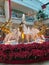 Red Poinsettia Flowers and Gold Reindeer Sculptures Around a Water Fountain in West Mall, West Moorings, Trinidad