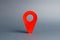 Red pointer location on a gray background. Concept of navigation and venue. Tourism and travel. Spying on the citizens.