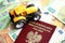 Red polish passport and yellow tractor on euro money bills