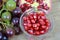 Red Pomegranate seeds and Grapes on the wooden background