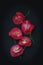 Red poppies on a black background, shot from above