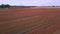 red poppyfield country road, summer meadow. Fantastic aerial view flight drone