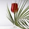 Red porto in luxury high glass decorated elegant curved green palm leaves in hard light with shadow in soft light white abstract.