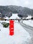 Red Post Box in Miyama Village Covered by Snow